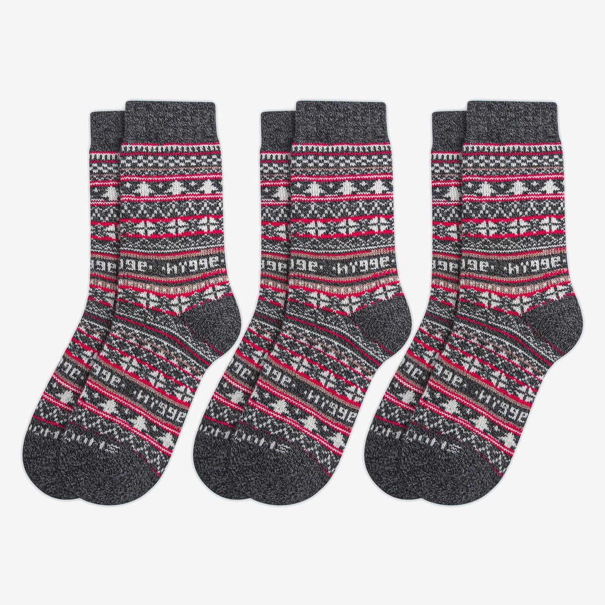 3 pairs of charcoal merino wool Swoollies socks with red and white pattern, on a light grey background