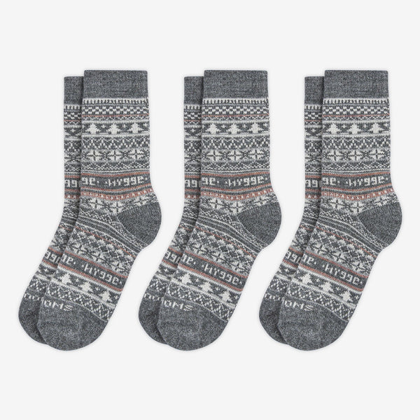 3 pairs pack of grey patterned merino wool Swoollies socks with the text 'hygge' knitted on it. The socks are thick. Socks are on a light grey background