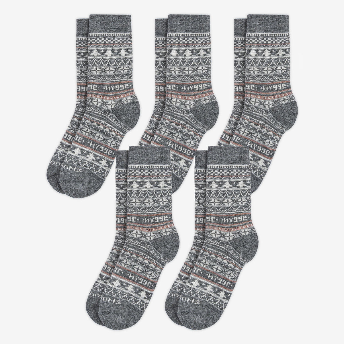 5 pairs pack of grey patterned merino wool Swoollies socks with the text 'hygge' knitted on it. The socks are thick. Socks are on a light grey background