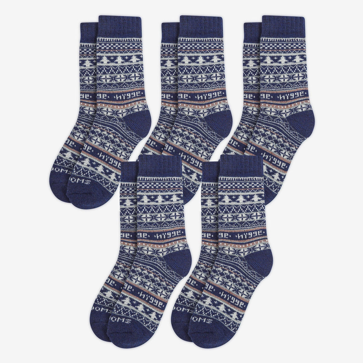 5 pairs pack of navy blue patterned merino wool Swoollies socks with the text 'hygge' knitted on it. The socks are thick. Socks are on a light grey background